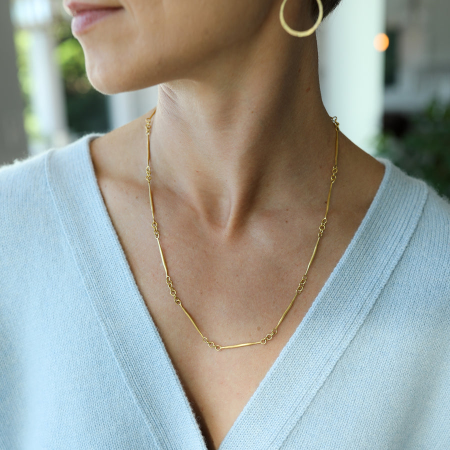 22k Gold Twig Chain Necklace hanging view 1 on model