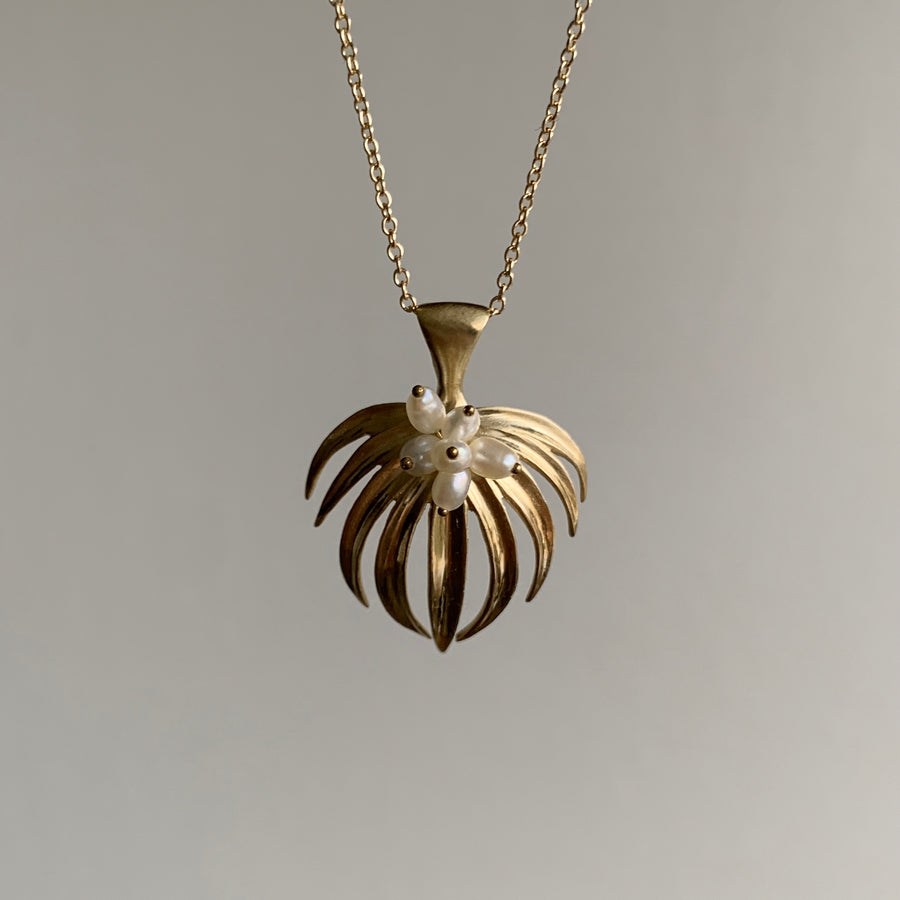 Annette Ferdinansen 10k Gold & Pearl Curled Fan Palm Pendant hanging view