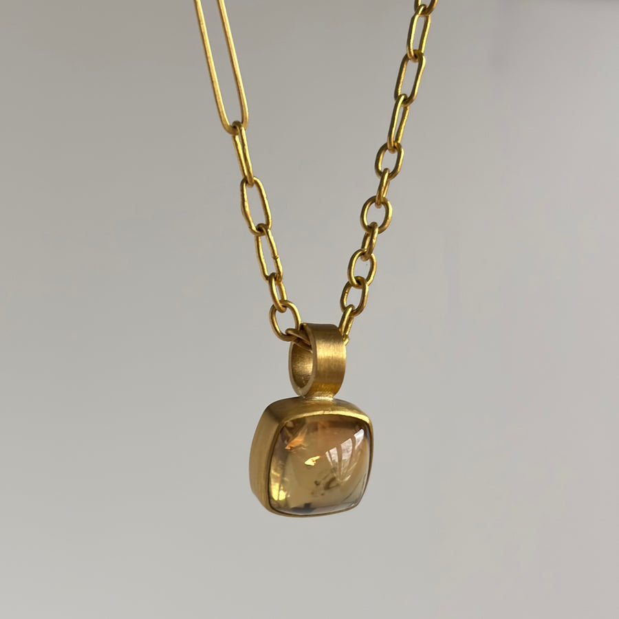  Bezel Set Apricot Tourmaline Sugarloaf Pendant hanging view 1