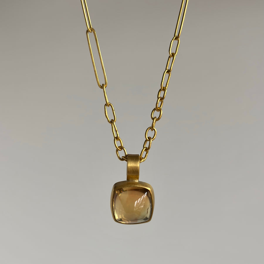  Bezel Set Apricot Tourmaline Sugarloaf Pendant hanging view 2