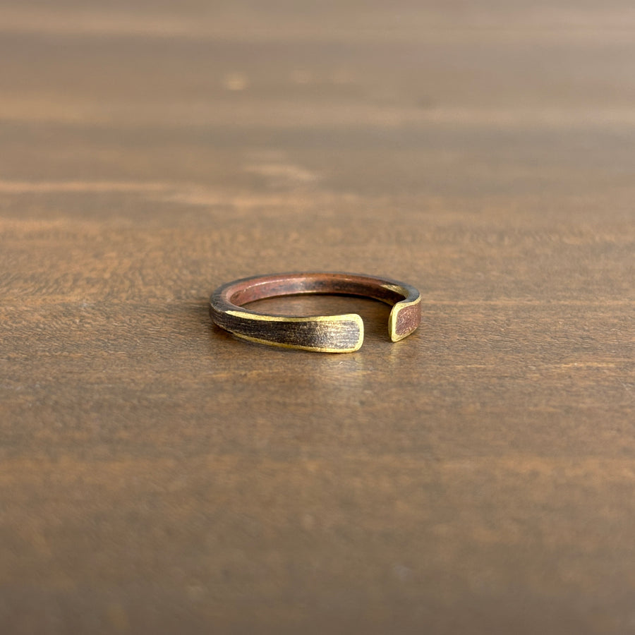 Gold ring on a wooden surface