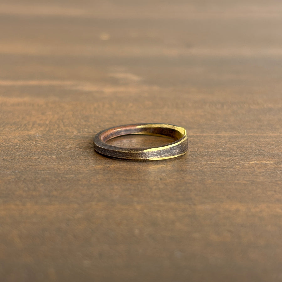Gold ring on a wooden surface