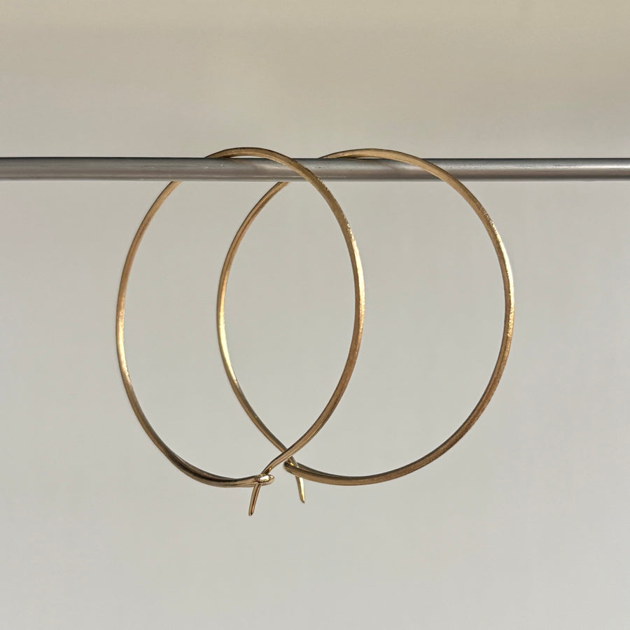 Eye of the Needle Hoop Earrings in 14k Gold hanging 2