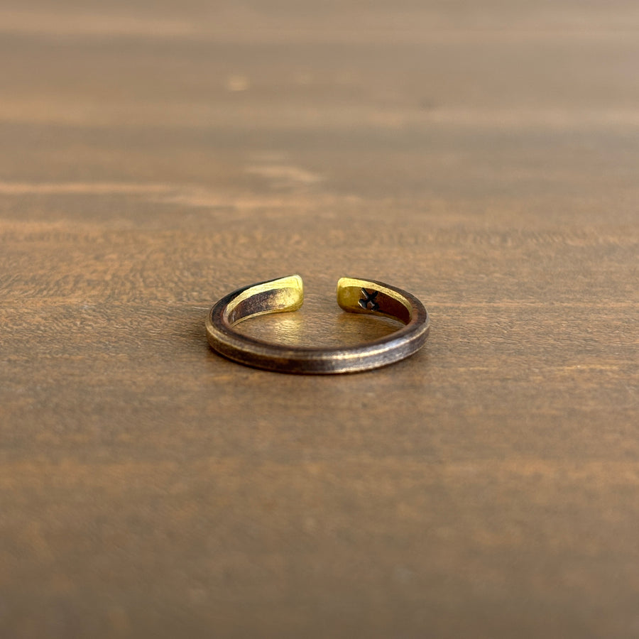 Gold ring on a wooden surface