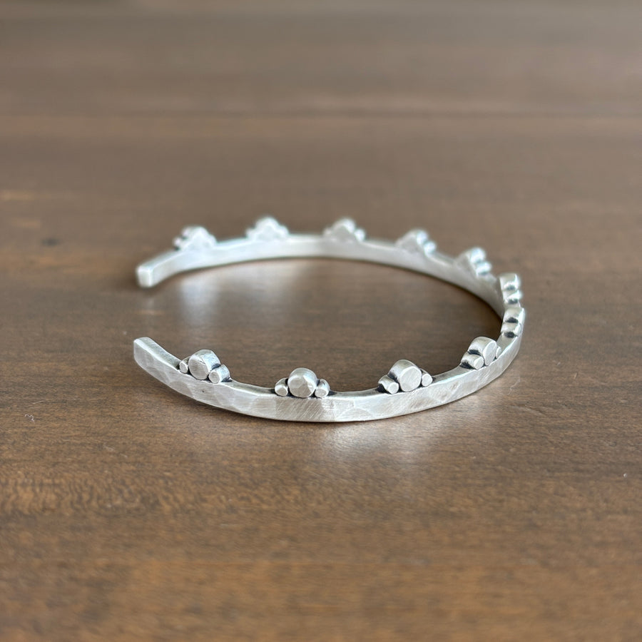 Silver bracelet on a wooden surface