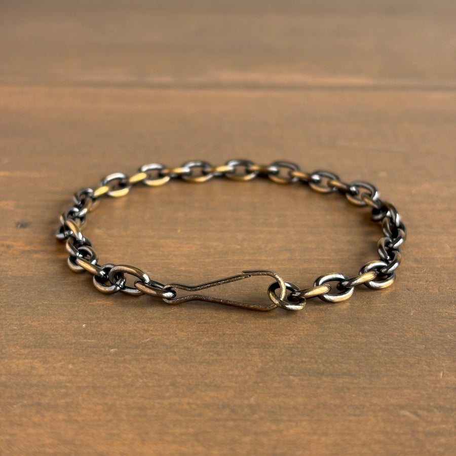 Chain bracelet on a wooden surface
