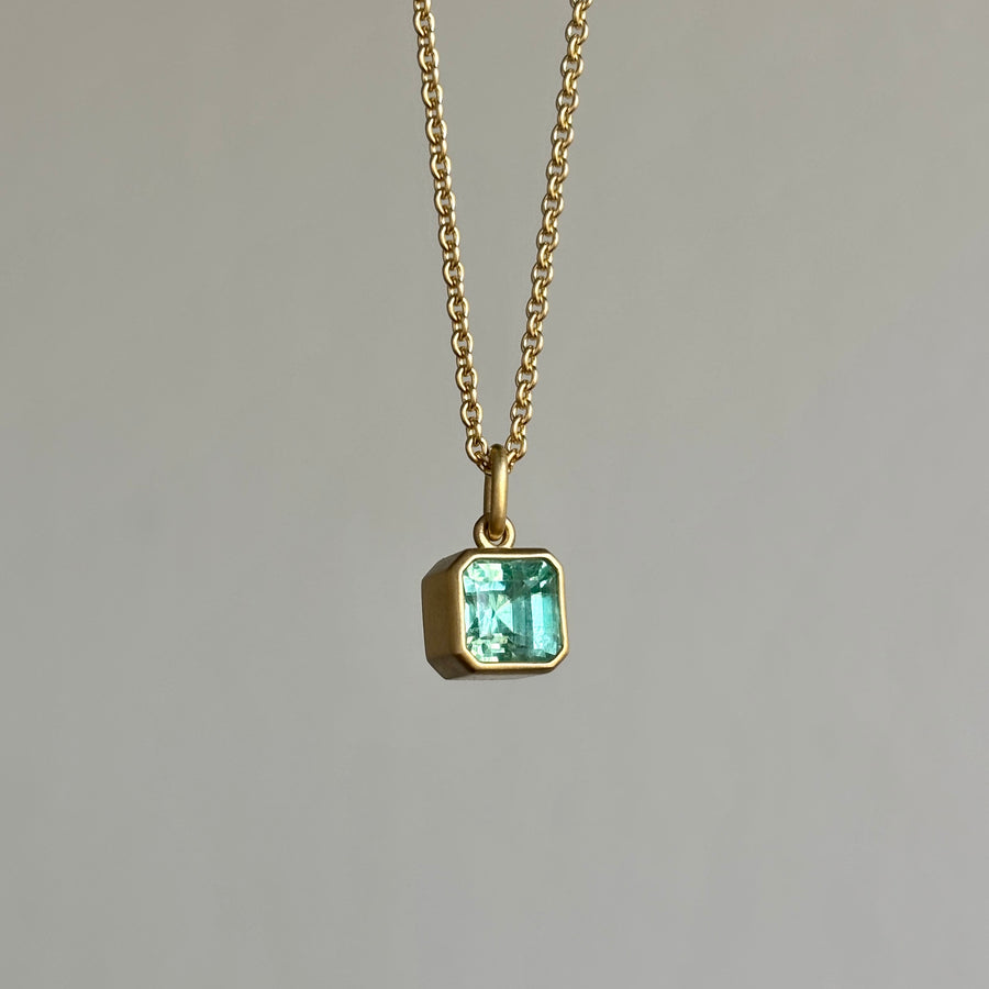 Lola Brooks Colombian Emerald Cube Pendant necklace hanging view 1