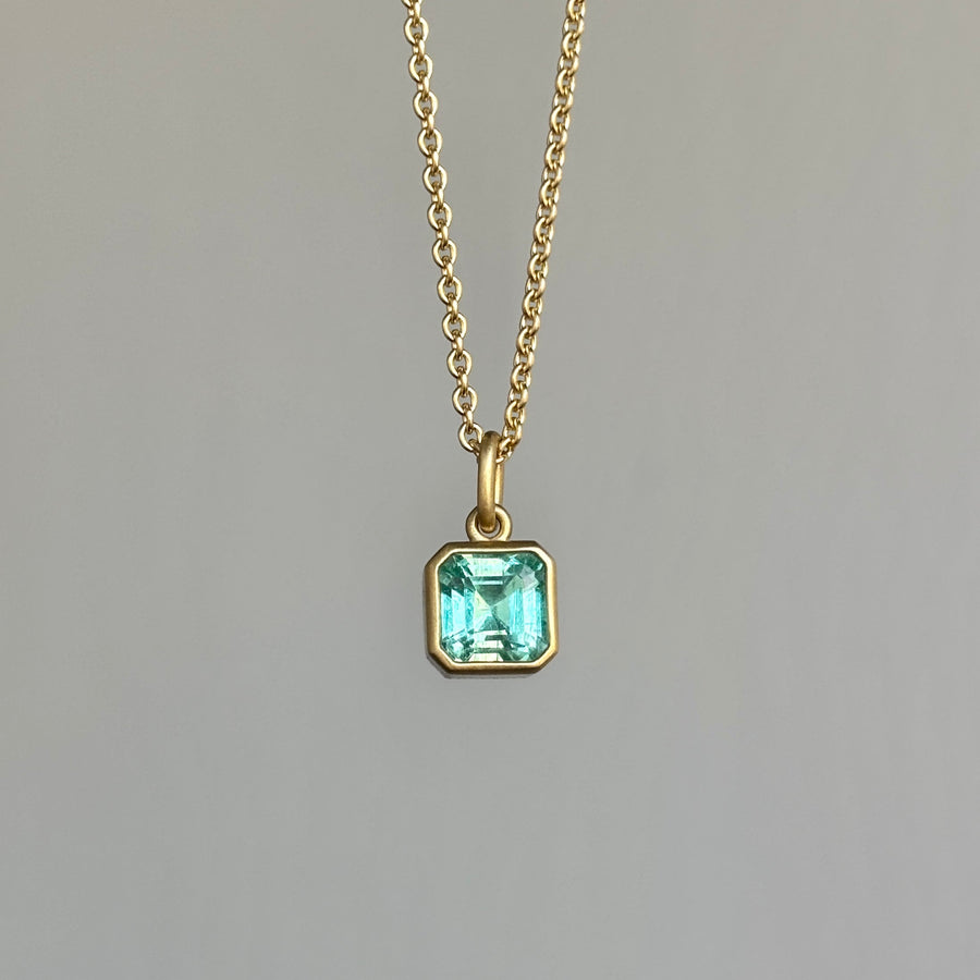 Lola Brooks Colombian Emerald Cube Pendant necklace hanging view 2