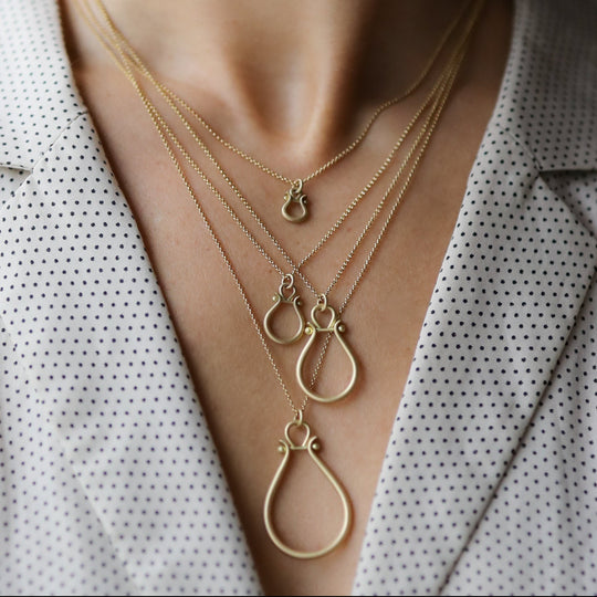 Gold Lyre Pendant by Monika Krol on model
