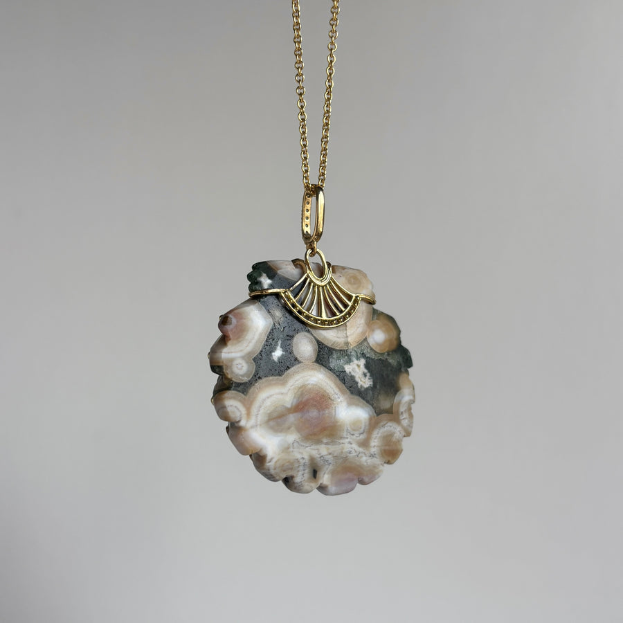 Necklace with a unique pendant on a gray background