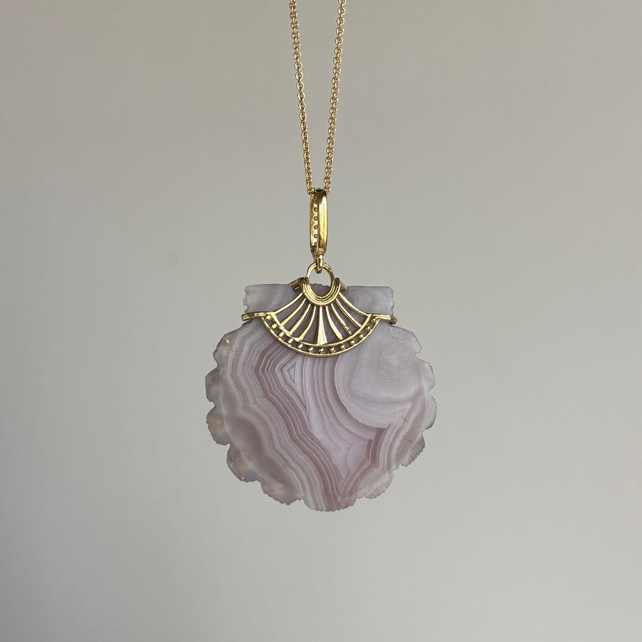 Necklace with a purple agate pendant on a gray background