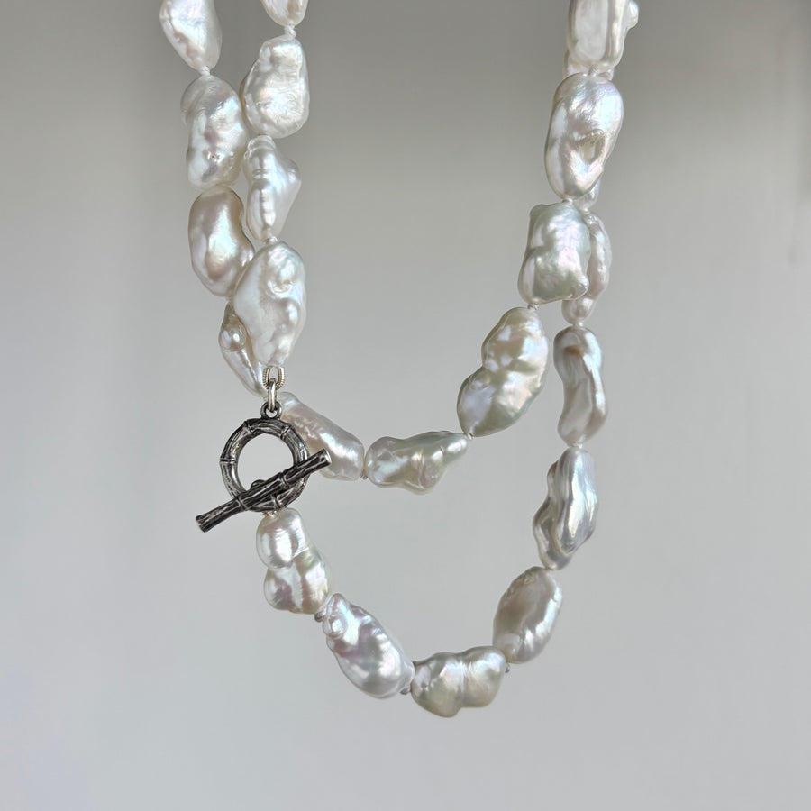 Mimi Favre Long Freshwater Baroque Pearl Strand Necklace hanging 