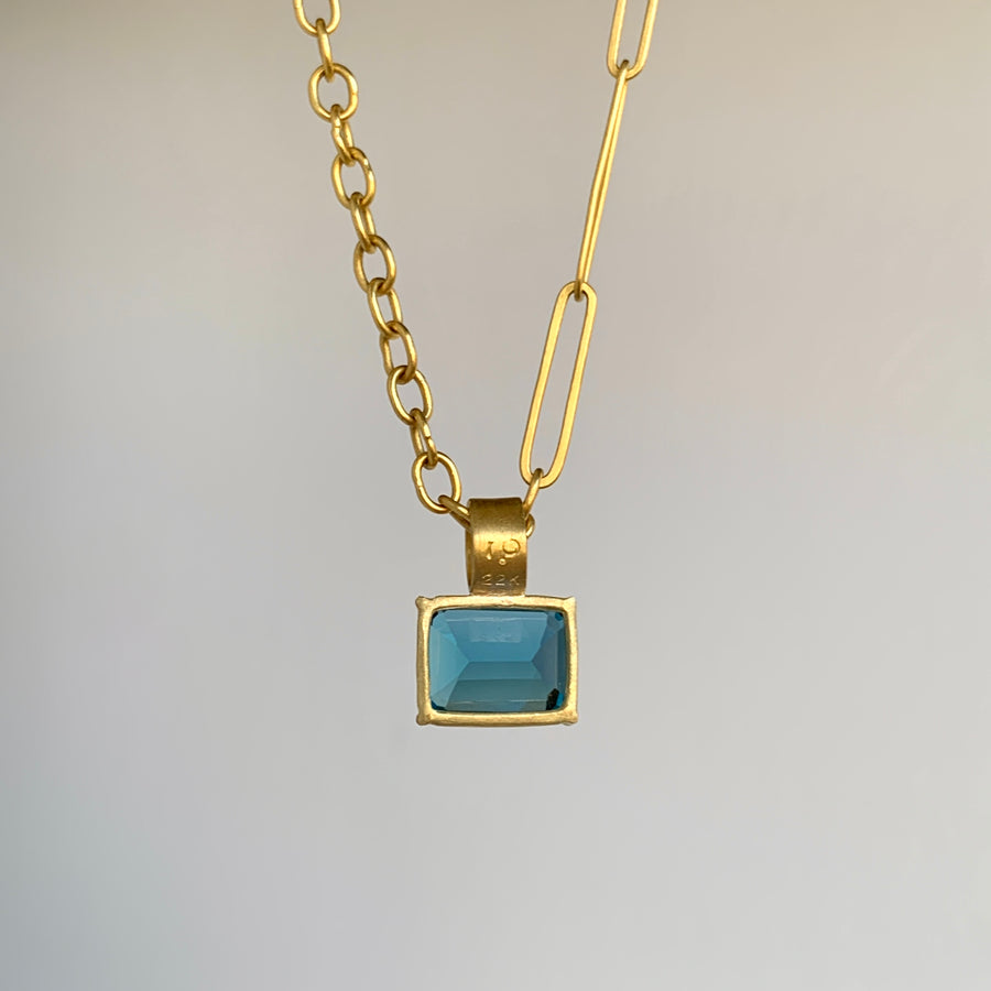 Petite Emerald Cut London Blue Topaz Pendant in 22k & 18k Gold back view hanging