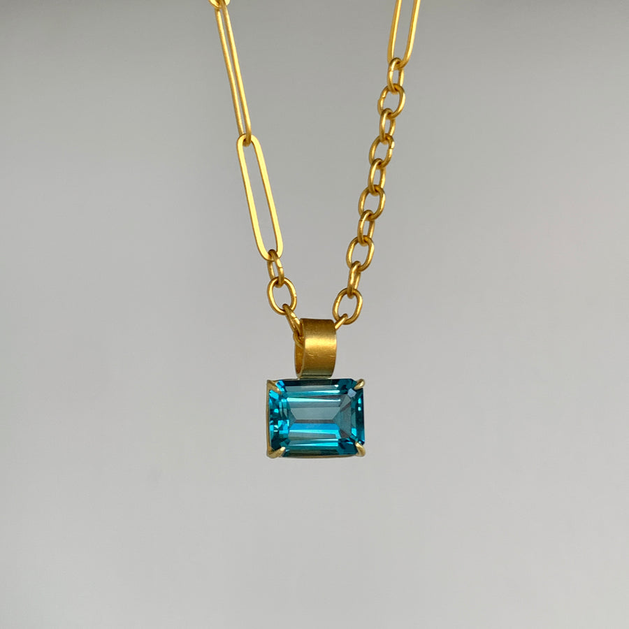 Petite Emerald Cut London Blue Topaz Pendant in 22k & 18k Gold front view hanging