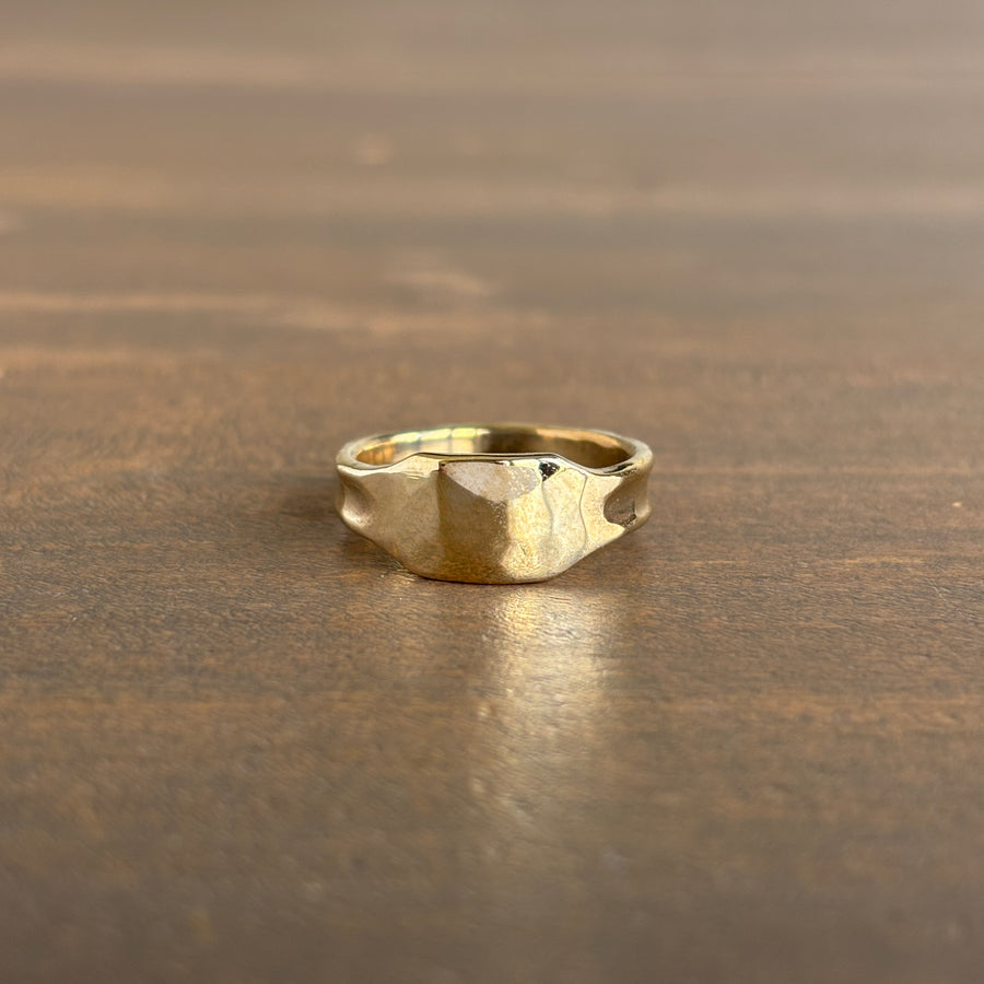 Gold ring on a wooden surface
