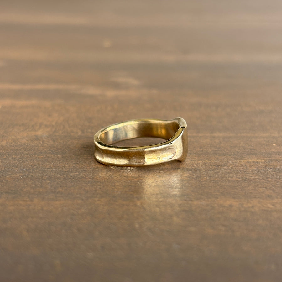 Gold ring on a wooden surface