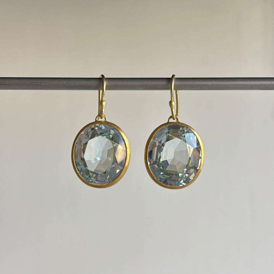 Rosanne Pugliese Bezel Set Faceted Oval Blue Topaz Earrings hanging view