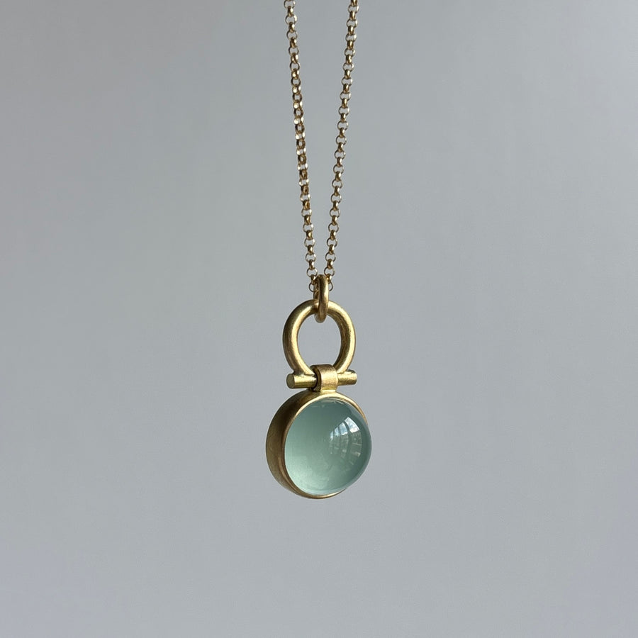 Round Milky Aquamarine Cabochon Pendant by Monika Krol hanging view