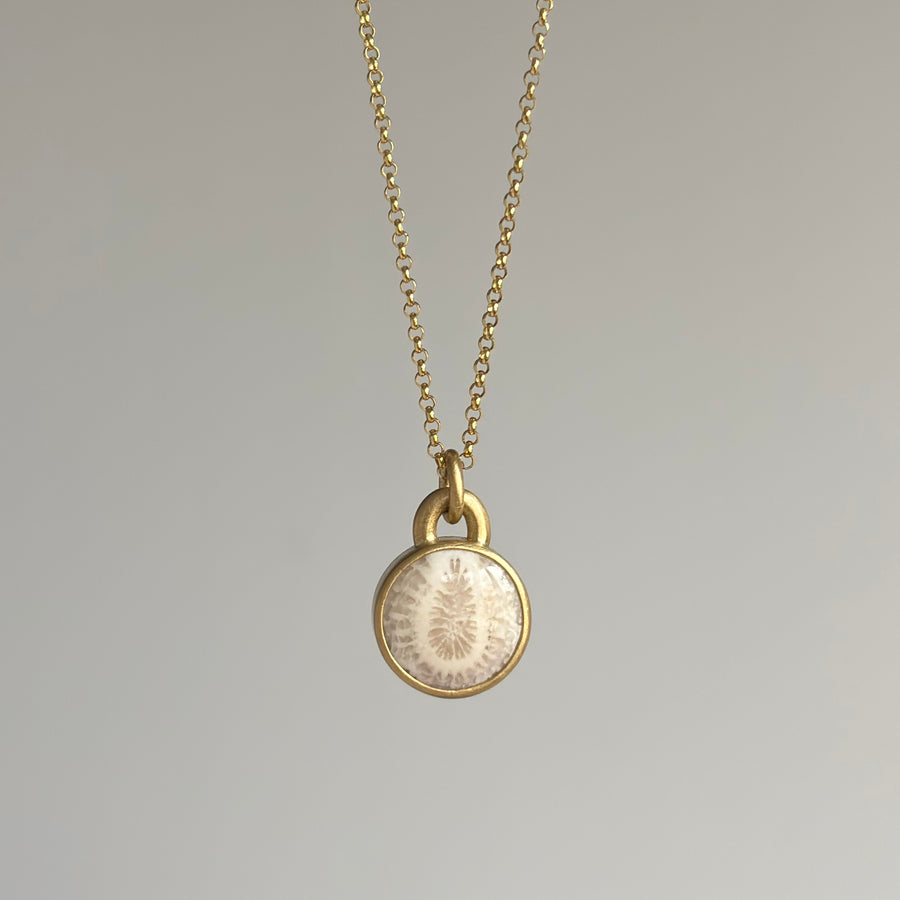 Round Petrified Coral Cabochon Pendant by Monika Krol hanging view