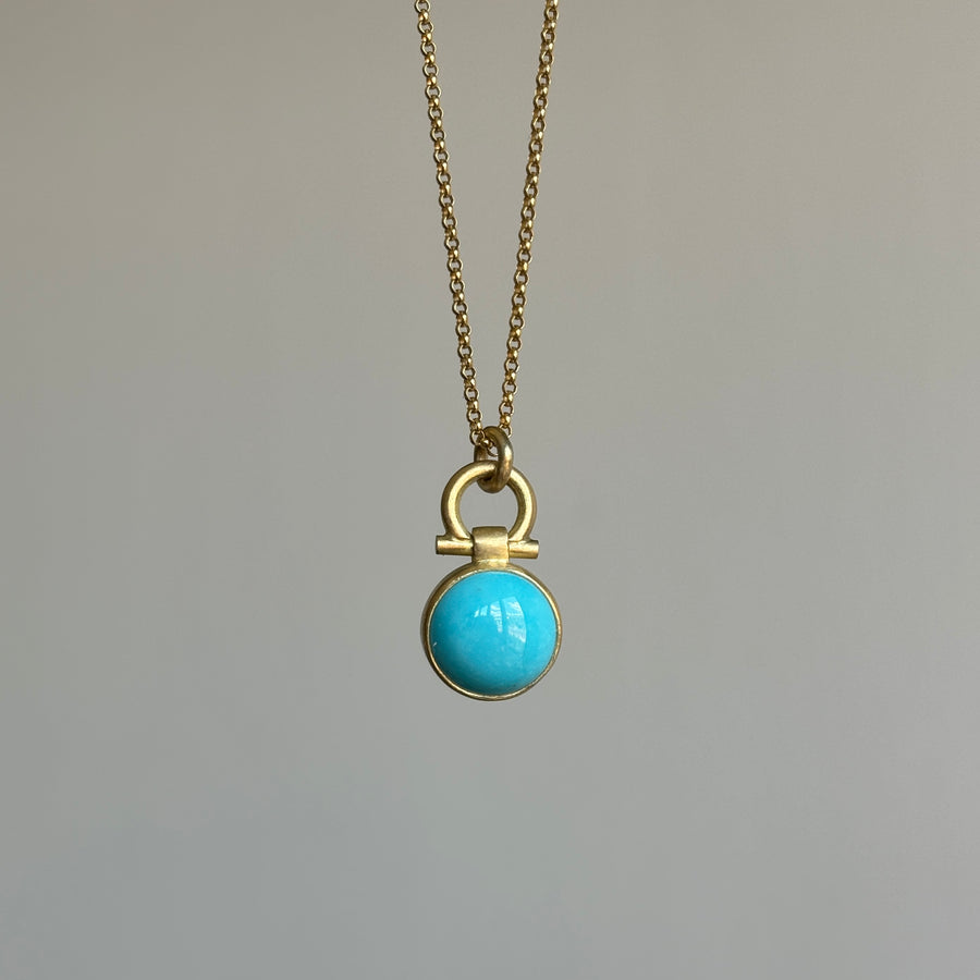 Round Sleeping Beauty Turquoise Pendant by Monika Krol hanging view