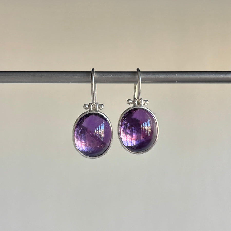 Silver Oval Violet Amethyst Cabochon Earrings by Monika Krol hanging view