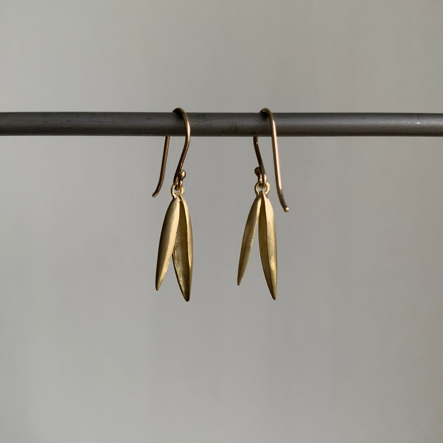 Small 10k Gold Oat Hull Earrings hanging