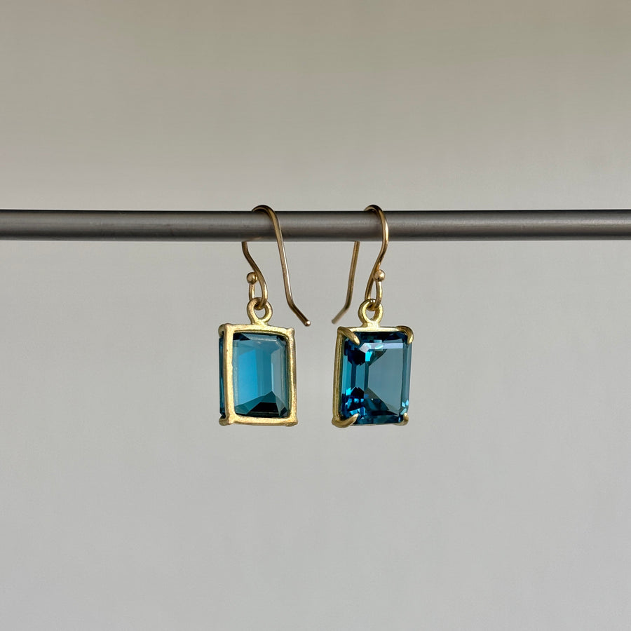 Small 18k Gold & Emerald Cut London Blue Topaz Earrings hanging 2