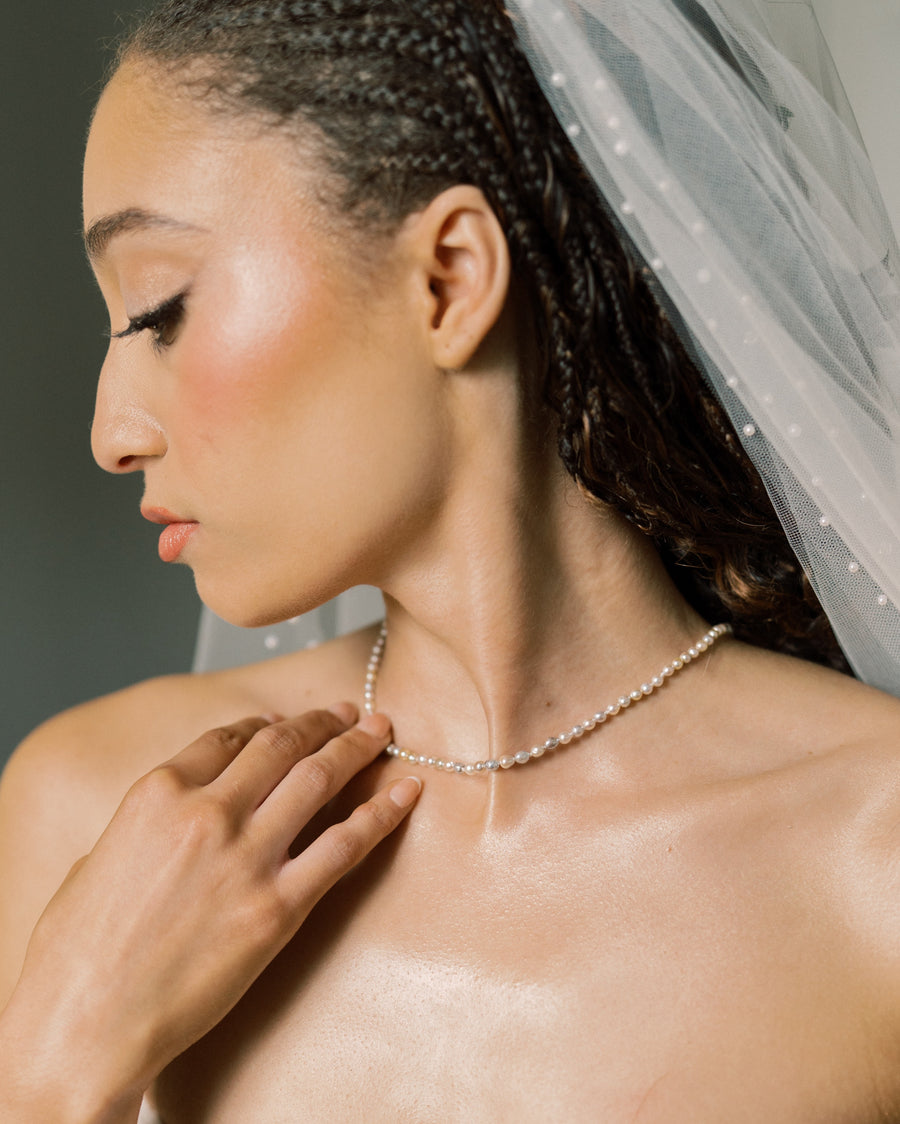 Pearl necklace styled with bridal veil