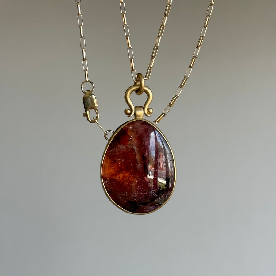 Watercolor Tourmaline Egg Pendant with Lyre Bail by Monika Krol hanging view