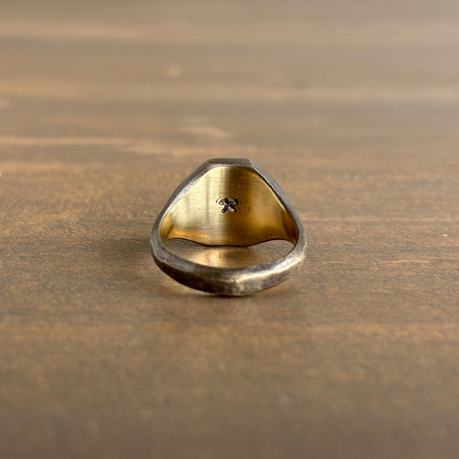 Gold ring  on a wooden surface