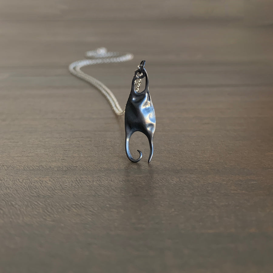 Little Silver Skate Egg Necklace
