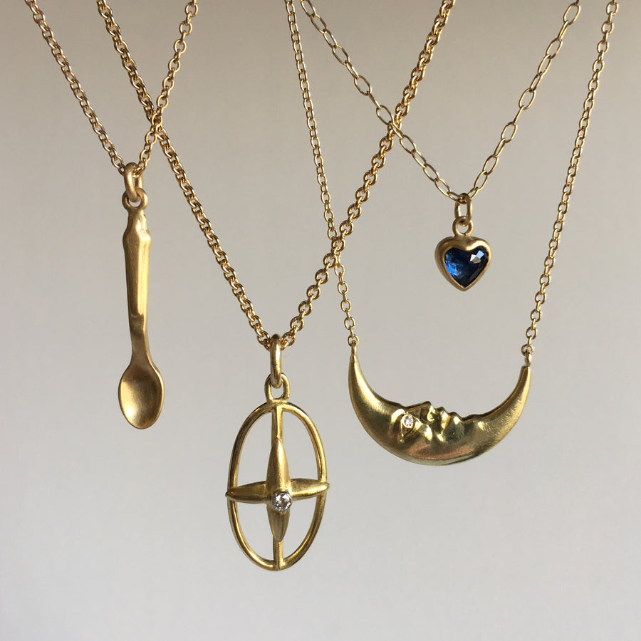 Gold Oval Star Cross Pendant